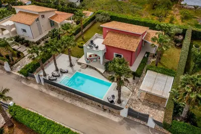 an aerial view of a house with a swimming pool at Villa Jacqueline con piscina privata 8 posti letto in Scopello