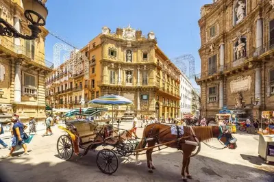 a horse drawn carriage in the middle of a city at 4 Canti Central Loft & Ground floor in Palermo