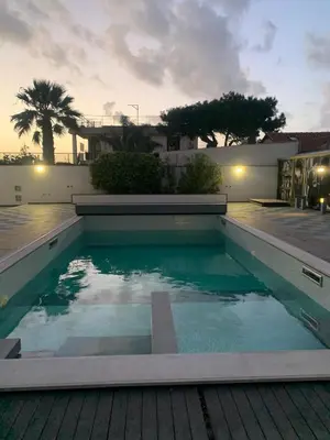 a swimming pool on top of a house at Villa Rubino in Isola delle Femmine