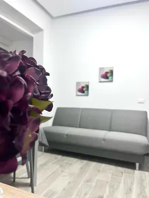 a living room with a couch and a table at Silvia's House in Castellammare del Golfo