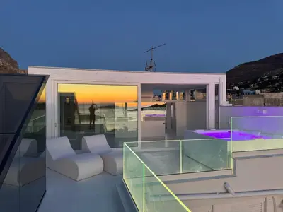 a balcony of a house with a view of the ocean at Attico sul Mare - Suite & Spa in Palermo