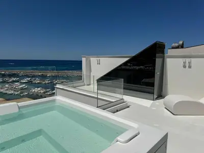 a swimming pool on top of a house at Attico sul Mare - Suite & Spa in Palermo