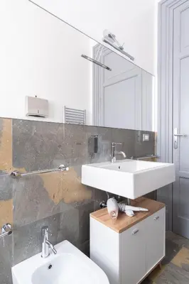 a bathroom with two sinks and a mirror at ROME 118 intero appartamento in Palermo