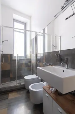 a bathroom with a sink and a toilet and a shower at ROME 118 intero appartamento in Palermo