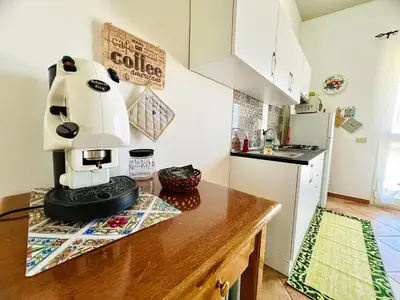 a kitchen with a coffee maker on a counter at Tri Ri Coppe in Cinisi