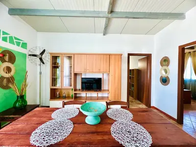 a living room with a table with a blue bowl on it at Tri Ri Coppe in Cinisi