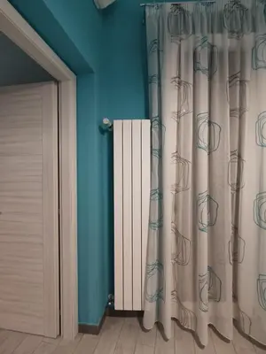 a room with a door with a curtain and a door at Casa vacanze Haliotis in Isola delle Femmine