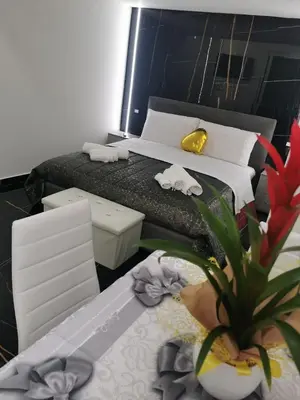 a bedroom with a bed and a potted plant at La casetta di gra in Palermo