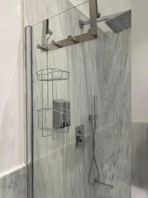 a shower with a shower head in a bathroom at Lily Suite 10 in Palermo