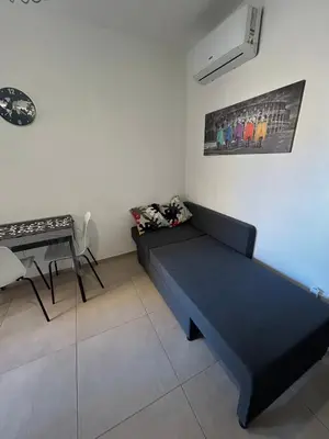 a living room with a couch and a table at La Cupola - casa vacanze n 10 in Termini Imerese