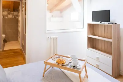 a living room with a coffee table and a tv at La Cecia Home in Castellammare del Golfo