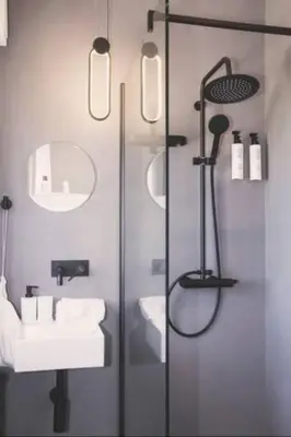 a bathroom with a shower and a toilet and a sink at Villa delle Sterlizie con piscina e jacuzzi by Le Dhome Sicily in Partinico