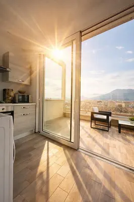 a balcony with a picnic table and a view of the city at Palermo Inn Marina Exclusive View in Palermo