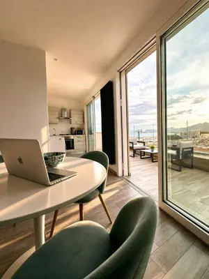 a view of a balcony with a table and chairs at Palermo Inn Marina Exclusive View in Palermo