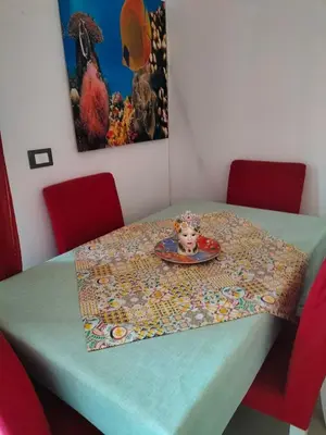 a table with a table cloth on it with a plate at Ciuridda mia in Palermo