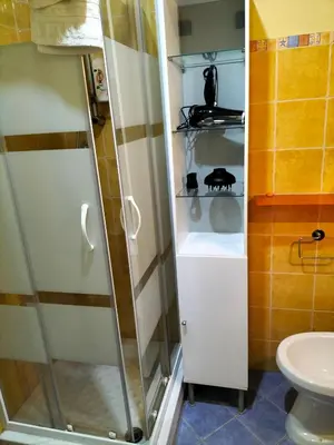 a bathroom with a shower and a toilet at Ciuridda mia in Palermo