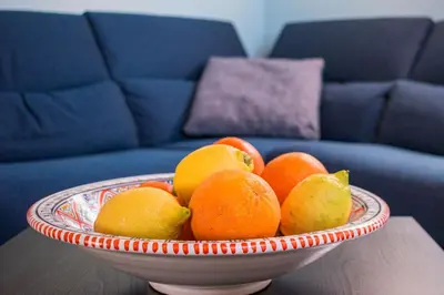a bowl of oranges and pears on a table at Villa Maguetta with private pool in Scopello in Scopello