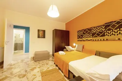a hotel room with two beds and a window at La Favorita - Ben collegato con l'aeroporto, la spiaggia di Mondello e il centro città in Palermo