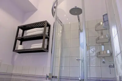 a bathroom with a shower and a mirror at La Favorita - Ben collegato con l'aeroporto, la spiaggia di Mondello e il centro città in Palermo