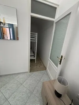 a room with a door and a window and a table at Fauka blu in Carini