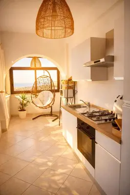 a dining room with a white table and chairs at Oltremare Suite N37 Benessere invernale con vista mare in Bagheria