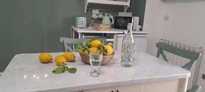 a kitchen counter with a basket of fruit on it at Casa di Nat in Palermo