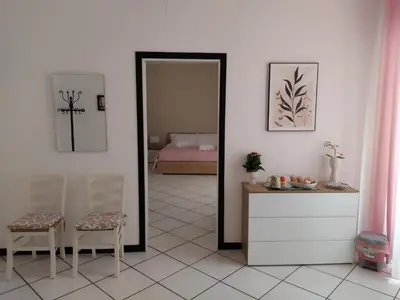 a bedroom with a bed with towels on it at Angolo Lamia Sicily Apartment in Partinico