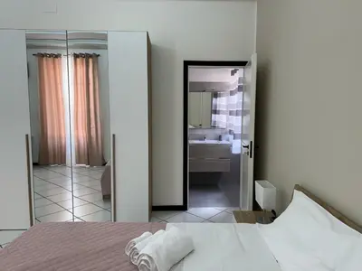 a room with a room with a window with a microwave at Angolo Lamia Sicily Apartment in Partinico