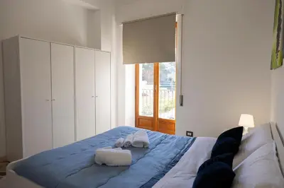 a bedroom with a bed with towels on it at STELLA BLU in Calatafimi