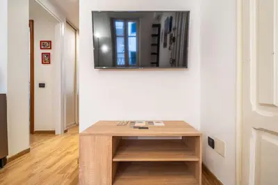 a table in a room with a mirror on a wall at [MoroHouse] 50mt from Teatro Massimo in Palermo