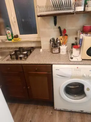 a kitchen with a white washing machine in a kitchen at EMILY'S HOUSE in Palermo