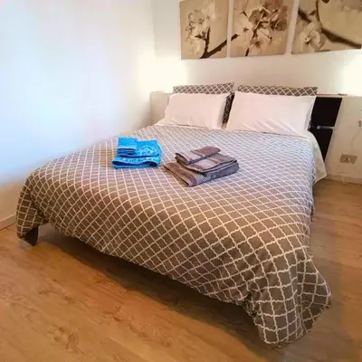 a bed with a blanket and two towels on it at [CENTRO STORICO] Casa Bellini ***** in Palermo