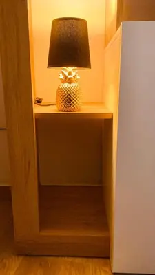 a lamp sitting on a night stand next to a room at Monteleone rooms in Palermo