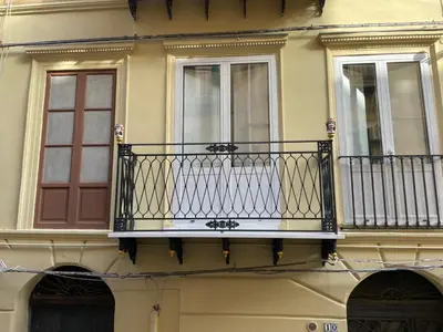a balcony on the side of a building at Casa Vacanze Donna MariaCarme' in Palermo