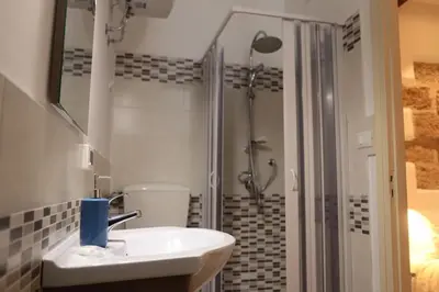 a bathroom with a sink and a shower at Casuzza palazzo storico, Stazione Centrale Palermo in Palermo