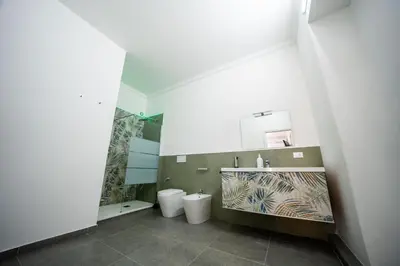 a bathroom with two toilets and a shower at Luna Marie in Palermo