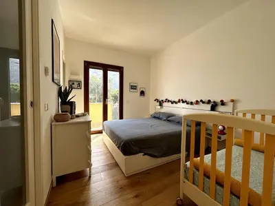 a bedroom with a bed and a staircase in it at Casa sul Mare alle porte di Palermo in Isola delle Femmine