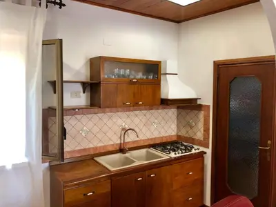 a kitchen with a sink and a stove at Capo Seralcadio in Palermo