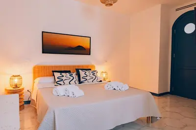 a bedroom with two beds with towels on them at Sant'Elia Luxury Home&Spa con accesso al mare in Santa Flavia