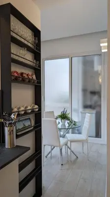 a kitchen with a table and chairs and a window at Don Armando al Massimo in Palermo