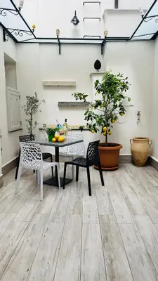 a dining room with a table and chairs at Casa Vacanze Donna Sidora in Palermo