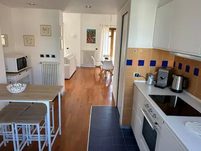 a kitchen with a table and a counter top at SiSo Home in Palermo