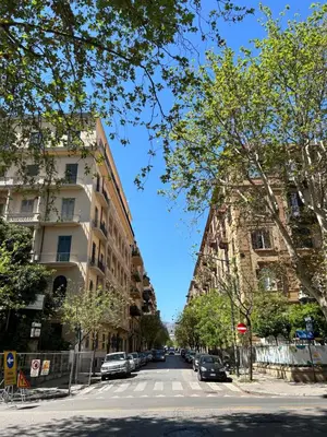 a street with buildings and cars parked on the street at SiSo Home in Palermo