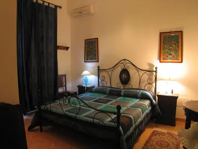 a bedroom with a bed in a room at The Garden in Sferracavallo