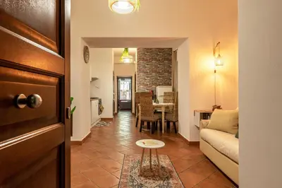 a living room with a couch and a table at Good Vibes apartment nel centro storico in Palermo