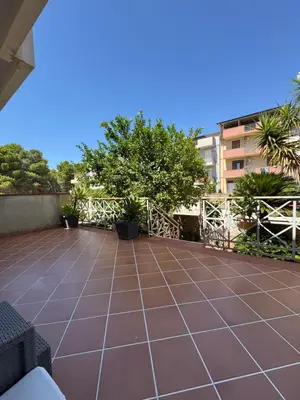 a patio with trees and plants in a building at CASA CRETTO in Salaparuta