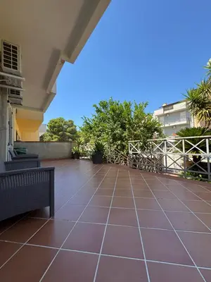 a large patio with a bench on a house at CASA CRETTO in Salaparuta