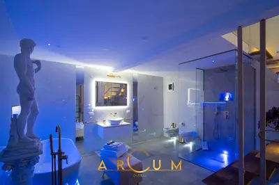 a bathroom with a shower and a toilet and a sink at ARCUM suites in Palermo