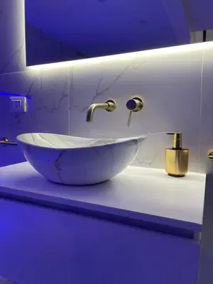 a bathroom with a bowl sink on a counter at ARCUM suites in Palermo