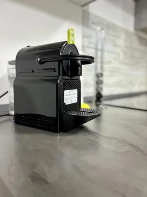 a black toaster sitting on top of a counter at Casa vacanze La Bonta' di Palermo in Palermo